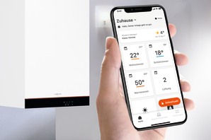 ViCare app on a phone controlling a wall mounted Viessmann boiler