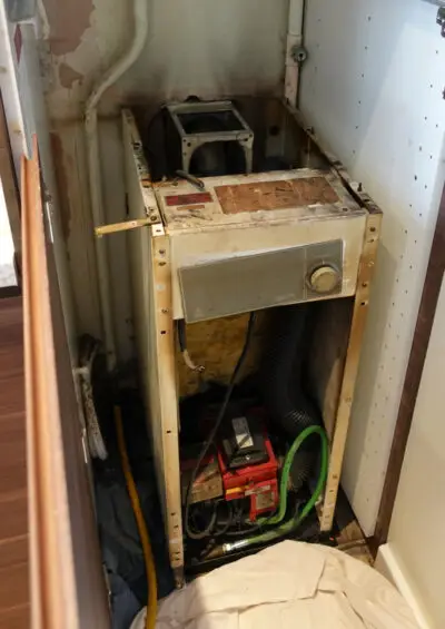 The original ageing internal oil boiler before replacement
